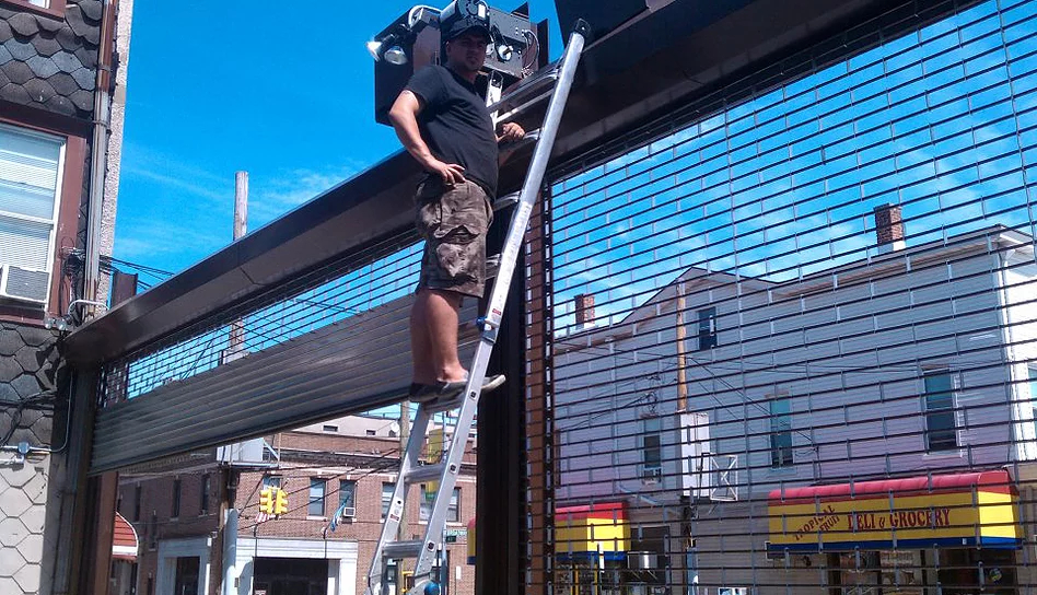 Double oversize outdoor driveway rollup gate repair - Chain link repair + motor replacement in NYC
